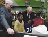 Photo shows Sir Barry Curtis with young pacific island children.